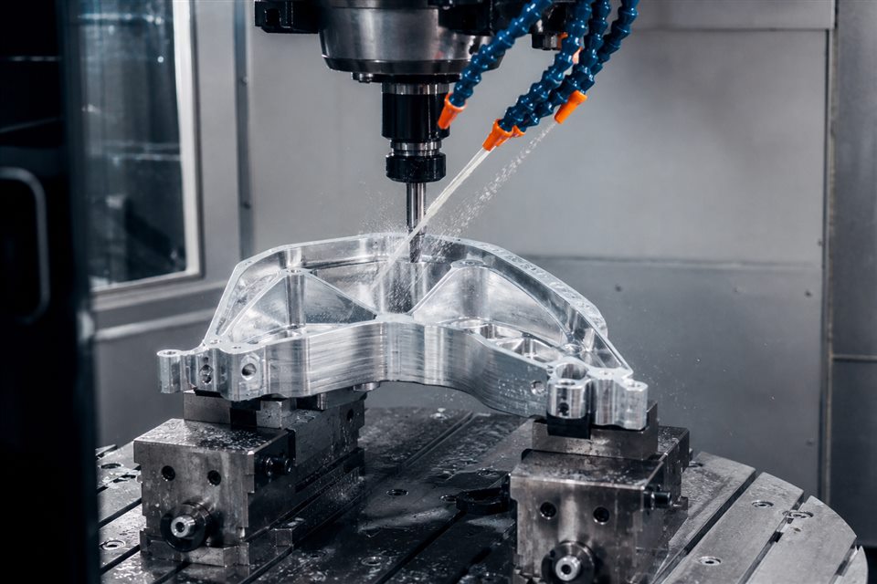CNC machining centre producing a precision aluminium component