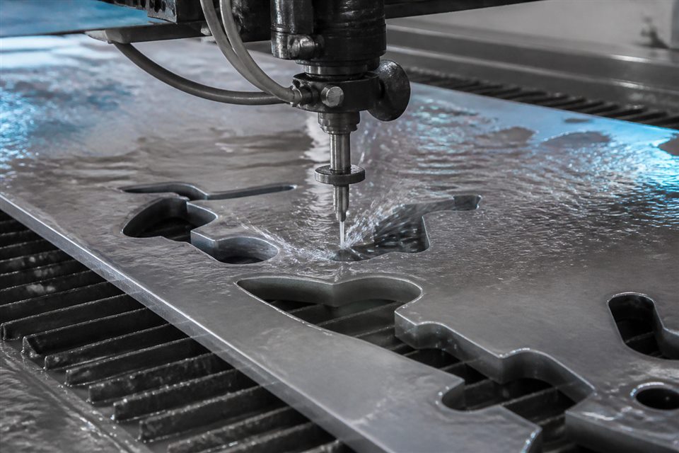 High-pressure waterjet cutting a thick metal plate